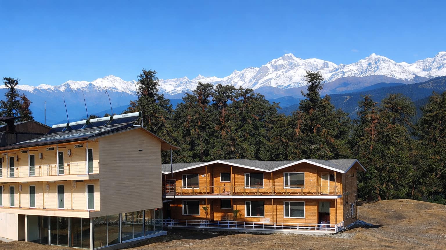 Chopta Resort Siberian pine wood cottages in an alpine meadow